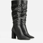 High-heeled boots with a wide upper