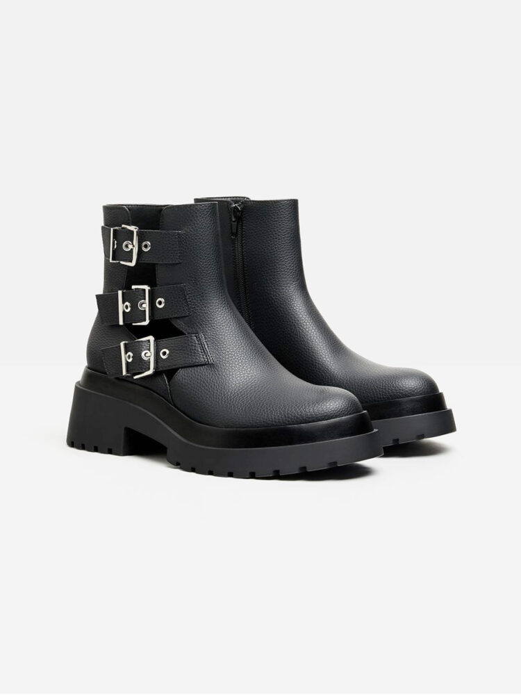 Flat ankle boots featuring cut-out detail with buckles